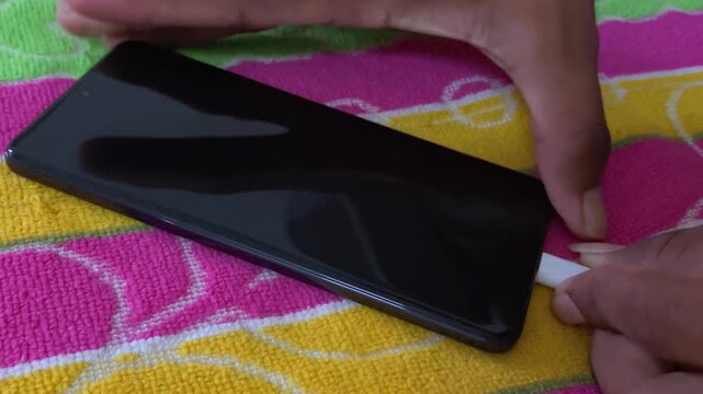 Inserting Type-C Charger into Smartphone and Charging