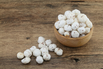 Fresh fox nuts or lotus seeds in wooden bowl