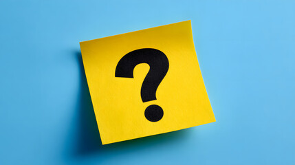 Yellow sticky note with question mark on blue background