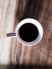 cup of coffee on wooden table