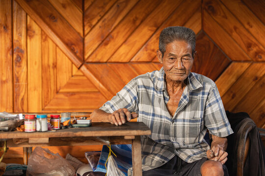 Elderly Thai Craftsman in Dan Chang Workshop