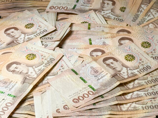 Large spread of Thai 1000 baht notes as a concept of wealth, profitable trading and successful...
