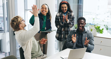 Creative, high five and people with applause at laptop for campaign success, team victory and...