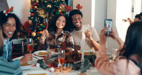 Cheers, champaign and friends with phone for christmas celebration, festive reunion and social media post. Holiday, people and photography for bonding with xmas, profile picture and memory at house