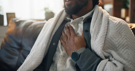 Sick, man and hands on chest pain, home and signs of heart attack, emergency and pressure in...