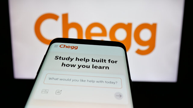 Stuttgart, Germany - 08-18-2025: Mobile phone with website of US edtech company Chegg Inc. on screen in front of logo. Focus on top-left of phone display.