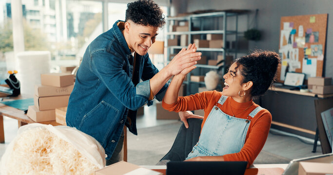 Happy people, high five and winning with laptop for small business success, good news or logistics. Excited, woman and man with touch or boxes for shipping service, distribution or online review
