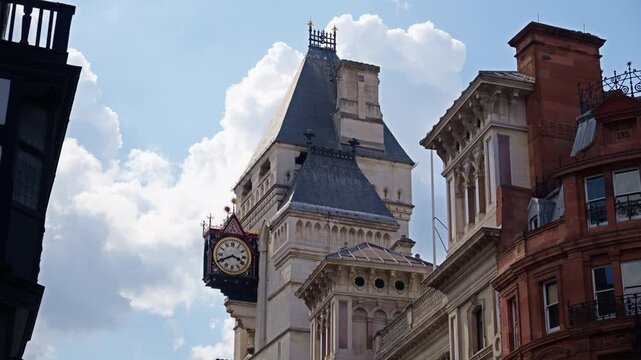Street view of the clock tower and of the Royal Courts of Justice in London, England