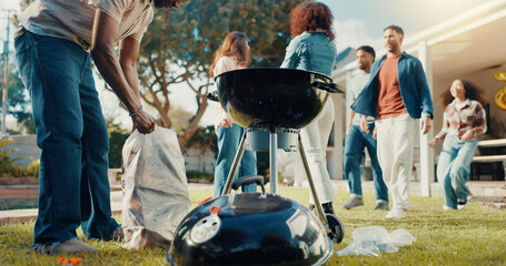 Man, friends and grill for bbq outdoor to start fire, new years party and social gathering. Person,...