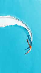 Minimalist pop art collage. Diver entering blue paper tear like breakthrough moment. Concept of challenge, transformation, exploration, athletic energy and new perspective.