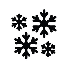 Black and white image featuring four snowflakes with different sizes and shapes