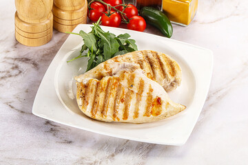 Grilled chicken breast served arugula