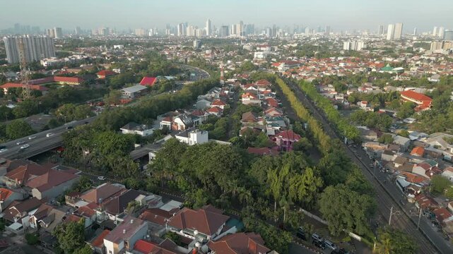 Bintaro Intersection Motorway And Railway Line At Sunset Jakarta City Indonesia Drone Track In 4K 60FPS