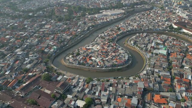 Canal Snakes Around Crowded Slum Neighborhoods In Tebet Jakarta Drone Rotate 4K 60FPS