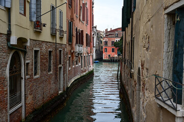 Gorgeous cityscape of Venice with narrow canals, boats and gondolas and bridges with traditional Colorful  buildings. Location: Venice, Veneto region, Italy, Europe