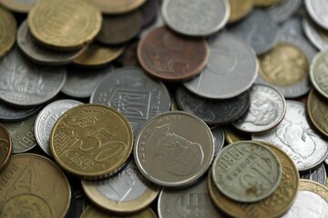 Big pile of different coins from various currencies and different countries around the world. Currency exchange