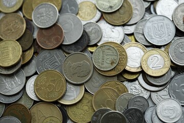 Big pile of different coins from various currencies and different countries around the world. Currency exchange