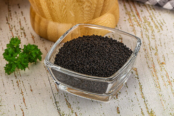 Black dry Nigella seeds in the bowl