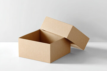 Cardboard box lying on white background, revealing spacious interior, symbolizing packaging, logistics, and potential contents waiting to be discovered