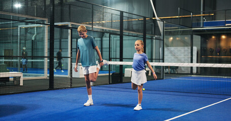 Fitness, tennis and children with leg stretching on court for warm up, practice routine or workout....