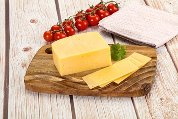 Yellow cheese piece with slices