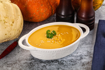 Vegan pumpkin cream soup served sesam