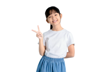 A cheerful young girl smiles while holding up a peace sign. She is wearing a white t-shirt and blue skirt. PNG 