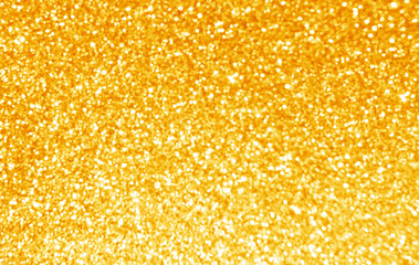 Golden yellow glitter bokeh background. Photo can be used for New Year, Christmas and all celebration concepts.