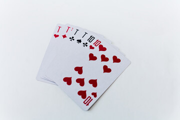 This close-up image features the ace, ten, jack, queen, and king of hearts, showcasing a classic deck of playing cards on a pristine white background. Perfect for card enthusiasts and designers