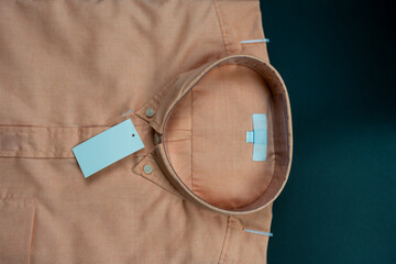Neatly pink shirt for men with a blank label.