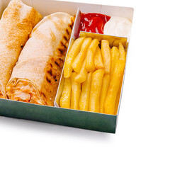 Delicious wrap and fries served in a takeout box with dips