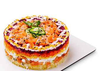 Layered salmon cake with colorful vegetables and cream cheese topping