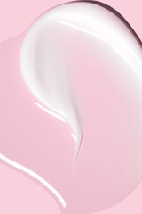 glossy cosmetic textures smooth stroke line cream products close-up on pink background