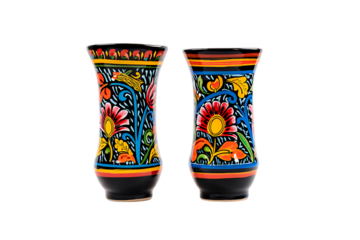 Pair of vibrant folk art decorative vases with intricate floral and abstract patterns on black