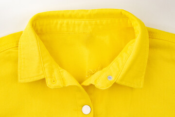 denim shirt made of yellow fabric with fringe, clothing details