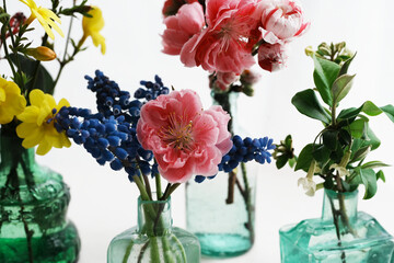 Antique Glass Bottles with Peach Blossoms and Spring Flowers