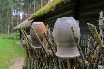 Ceramic pots on the wooden fence