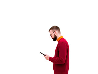 Young man in red sweater and glasses standing sideways, holding smartphone and looking at screen, isolated on transparent background, casual style, focused expression