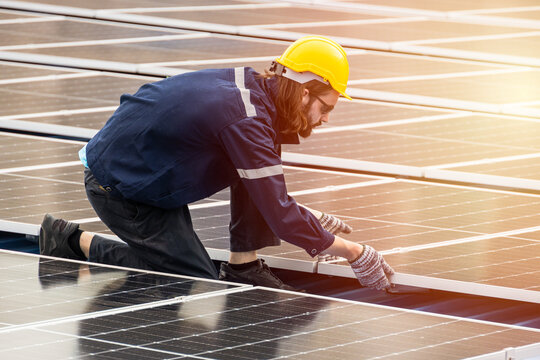 Professional Engineer Service Solar Panel. Worker Maintenance Cleaning Replacing Solar Panel. Solar photovoltaic panel system in Industry roof. Saving Energy with Clean Power.