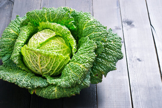 savoy cabbage from organic grower farm, on black wooden table