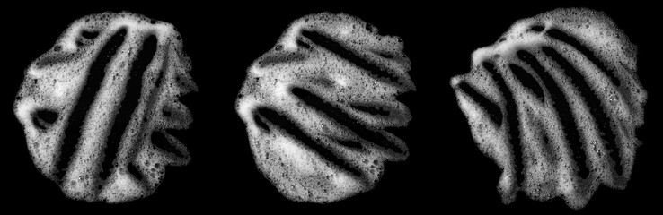 Abstract soap bubbles set, shampoo or shaving cream. Isolated soap bubbles on black background with texture and contrast background.