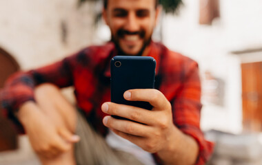 Close up view of man using smartphones