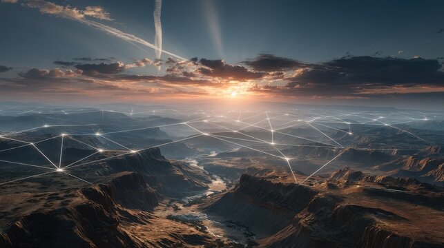 A stunning aerial view of a canyon landscape at sunset, with a network of lines symbolizing connectivity