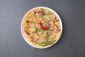 Gray background Seafood pancake, a traditional Korean dish 회색배경 한국의 전통 음식인 해물 부침개