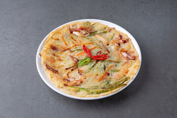 Gray background Seafood pancake, a traditional Korean dish 회색배경 한국의 전통 음식인 해물 부침개