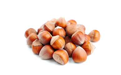 Pile of hazelnuts on a white background