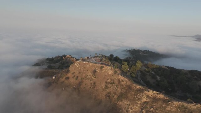 Remote Off-Grid Power System &mdash; Aerial of a solar panel installation on a mountain summit, RAW D-Log