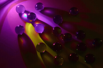 Cosmic fantasy of glass marbles glowing like mysterious planets in galaxy, colorful universe...
