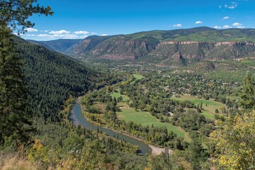 Fototapeta premium Scenic River Valley And Mountain Range