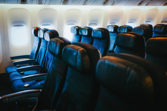Interior of an airplane cabin with empty seats